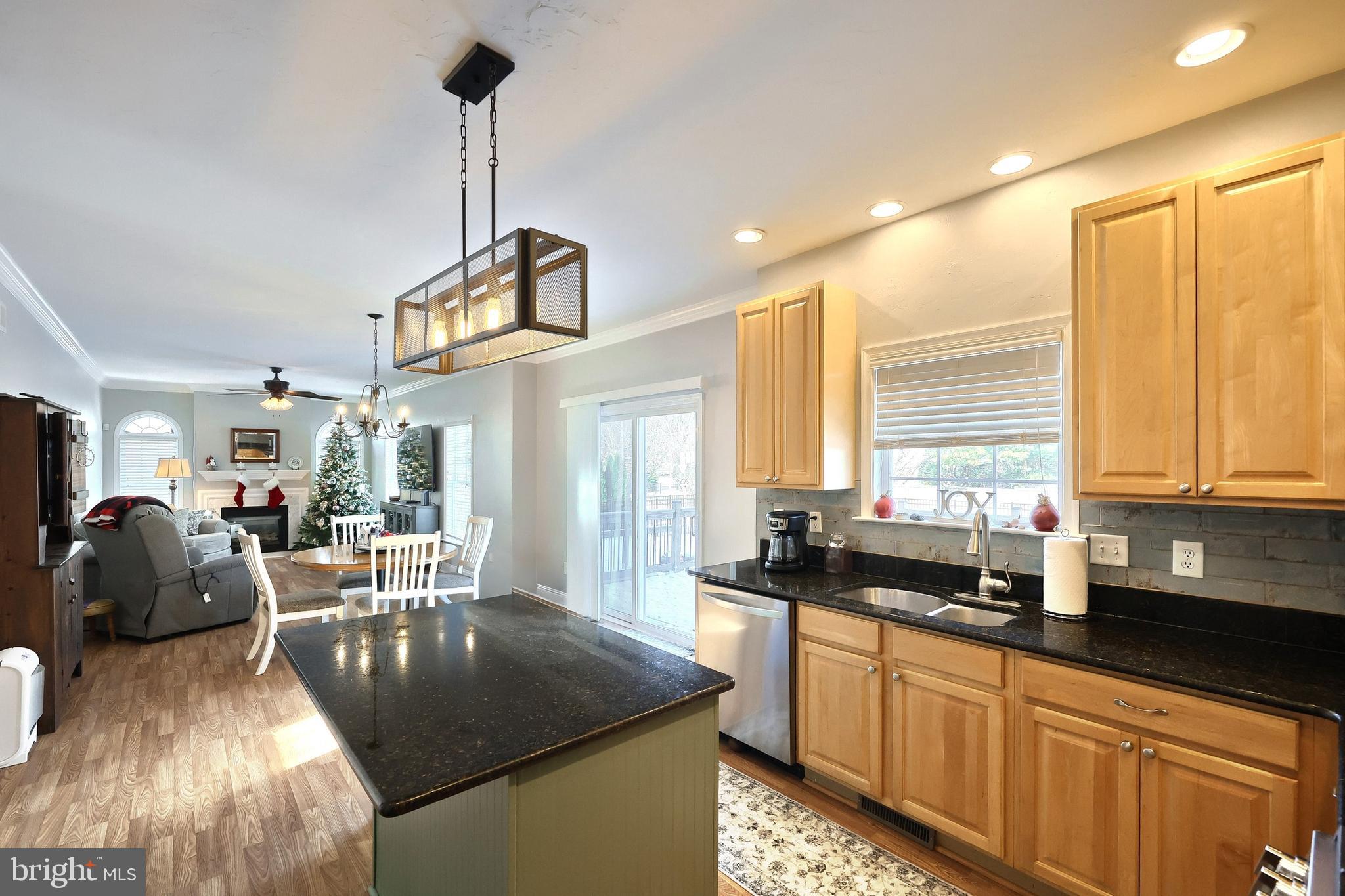 1 Hickory Lane Littlestown, PA 17340 - Photo 6 of 49 a kitchen with stainless steel appliances granite countertop a sink a stove and a wooden floors