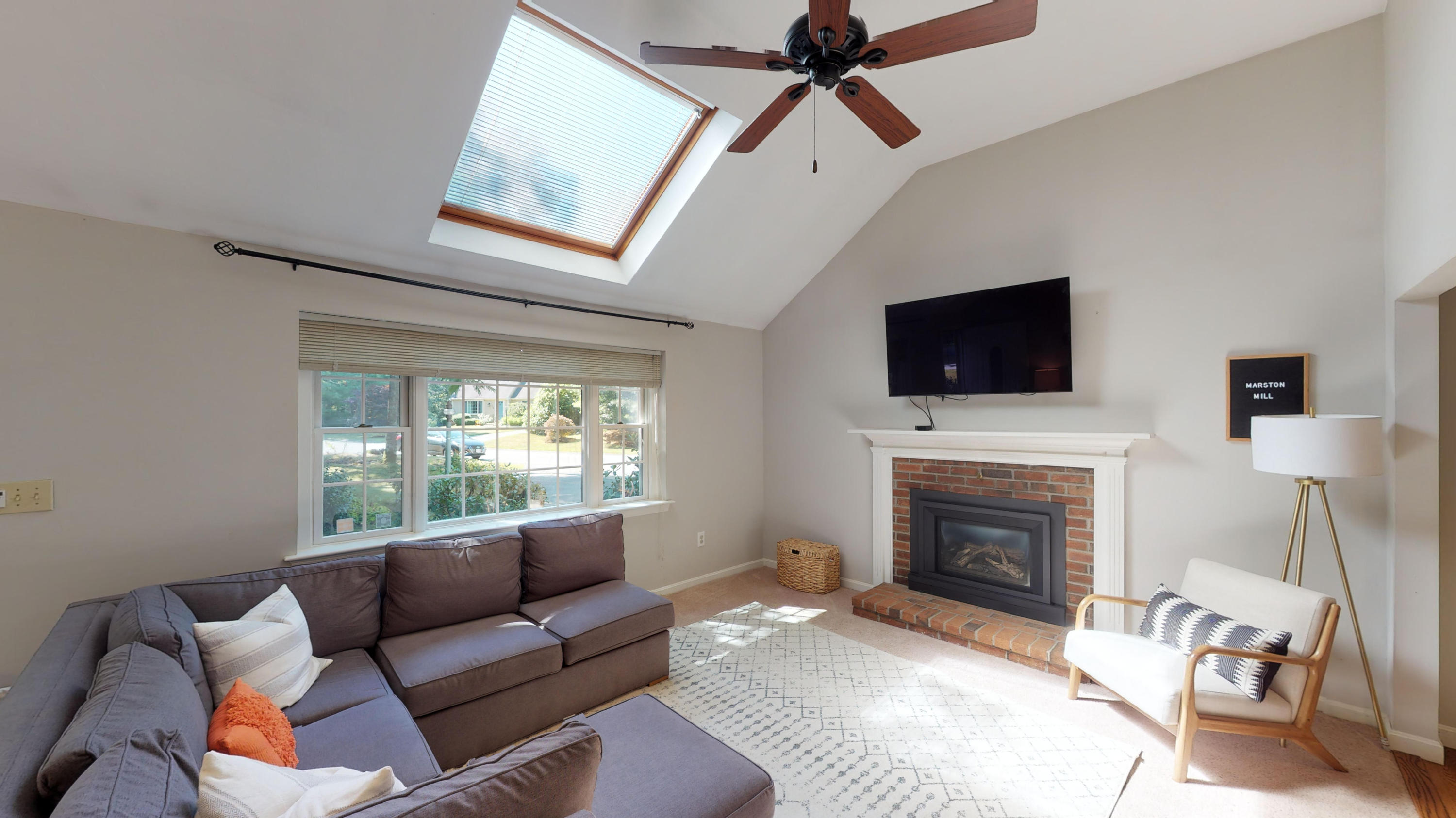 185 Sandy Valley Road Marstons Mills, MA 02648 - Photo 13 of 35 a living room with furniture a fireplace and a flat screen tv