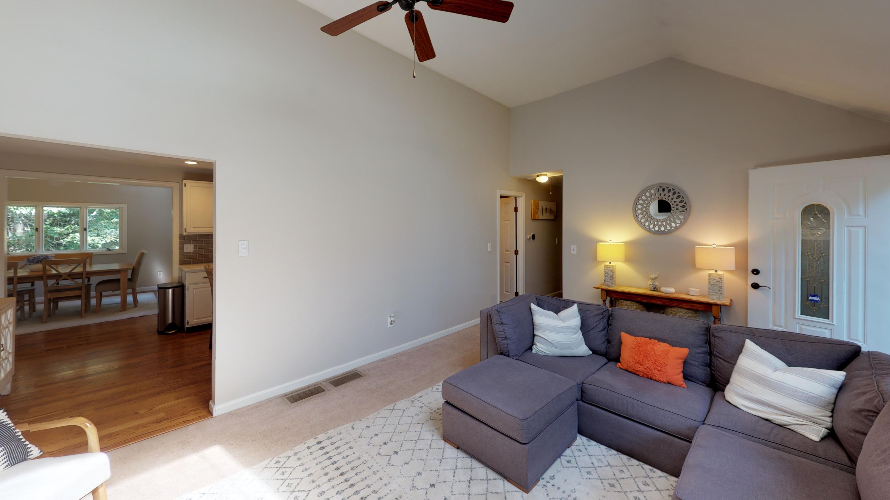 185 Sandy Valley Road Marstons Mills, MA 02648 - Photo 15 of 35 a living room with furniture and a lamp