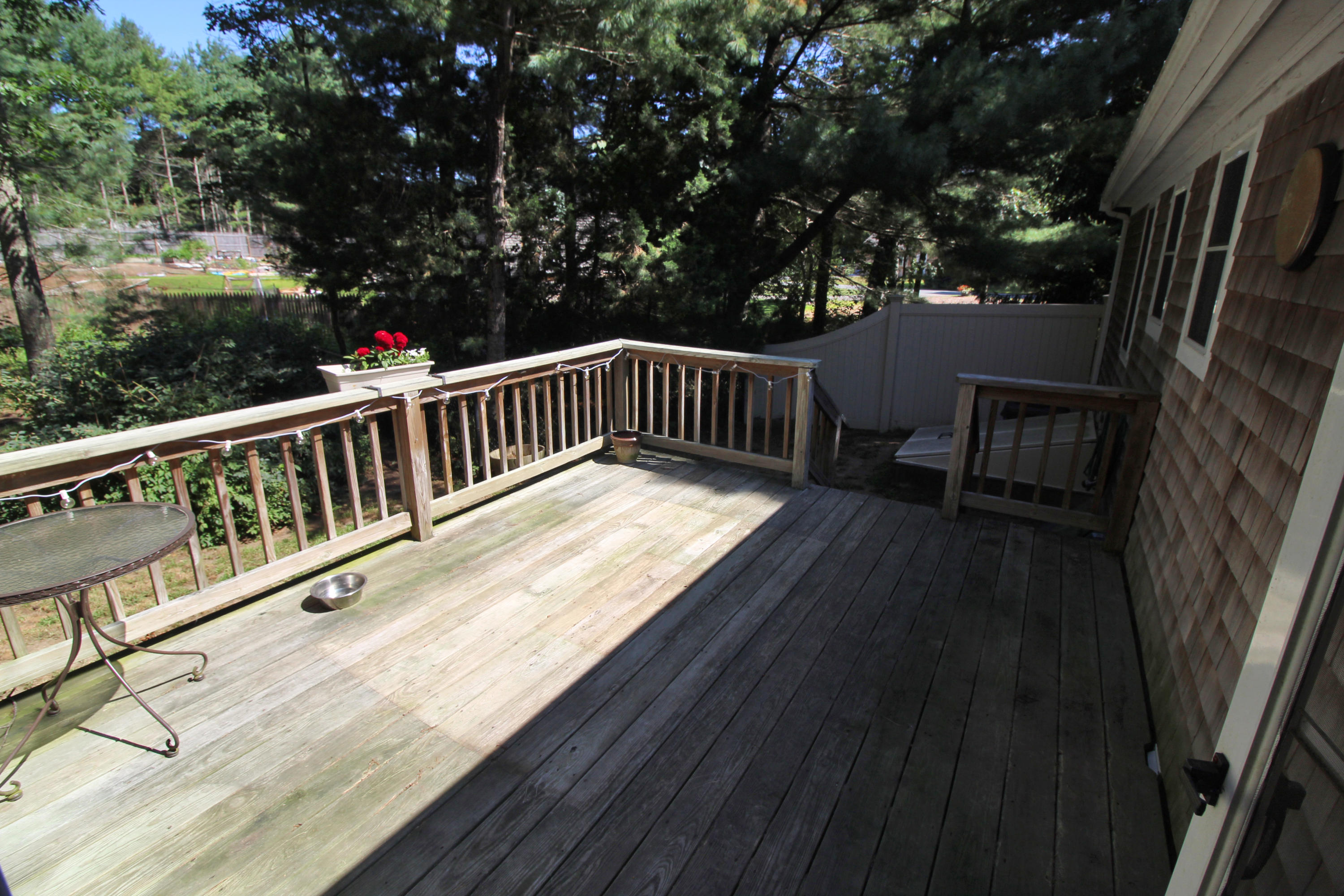 185 Sandy Valley Road Marstons Mills, MA 02648 - Photo 7 of 35 a view of balcony with wooden floor and fence