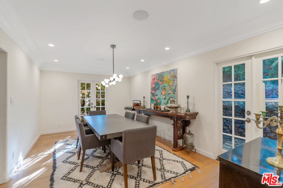 1643 Queens Road Los Angeles, CA 90069 - Photo 11 of 44 a view of a dining room with furniture and wooden floor