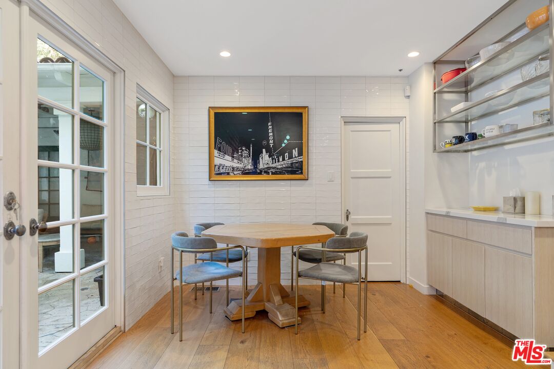 1643 Queens Road Los Angeles, CA 90069 - Photo 15 of 44 a view of a workspace with furniture and wooden floor