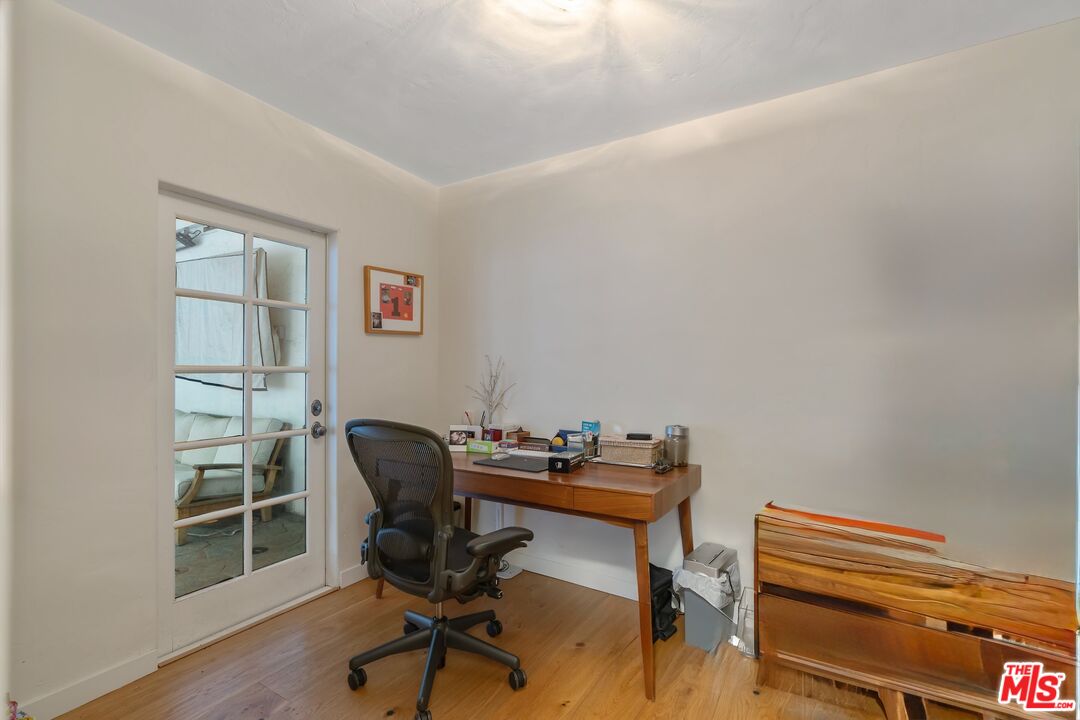 1643 Queens Road Los Angeles, CA 90069 - Photo 19 of 44 a view of a workspace with furniture and wooden floor