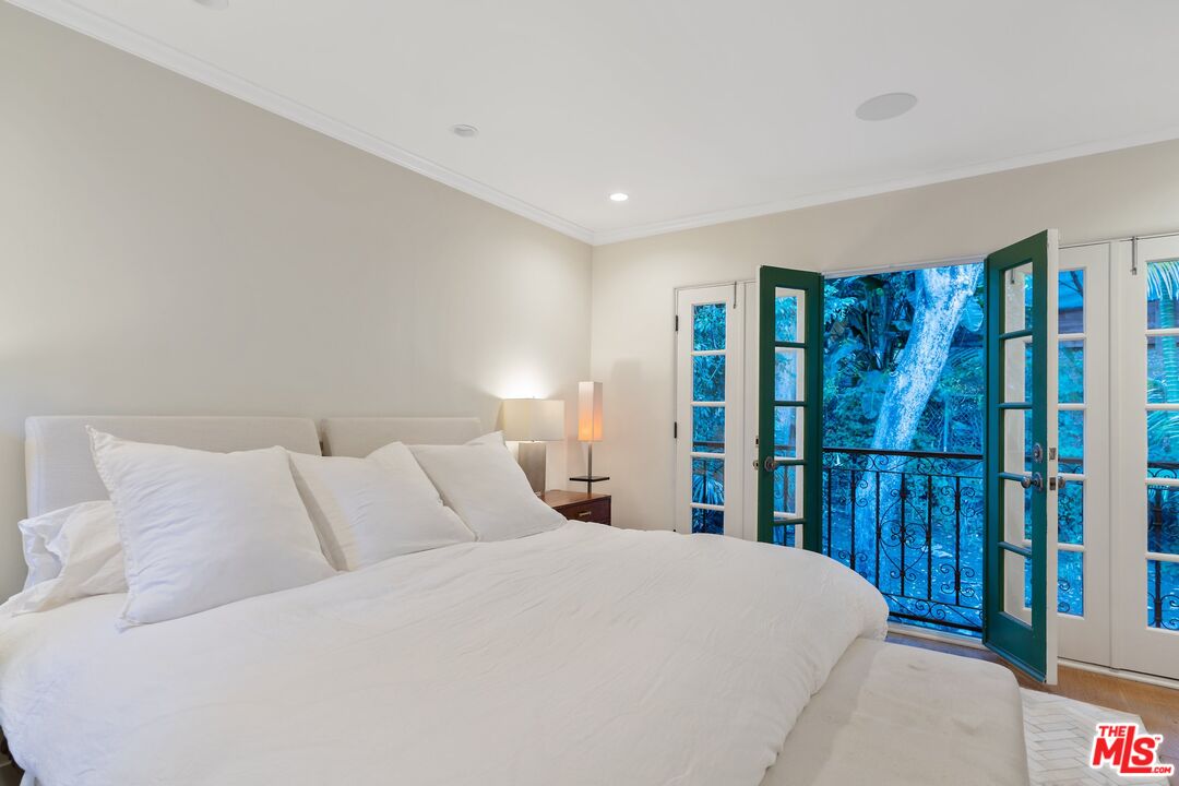 1643 Queens Road Los Angeles, CA 90069 - Photo 24 of 44 a bedroom with a large bed and a large window