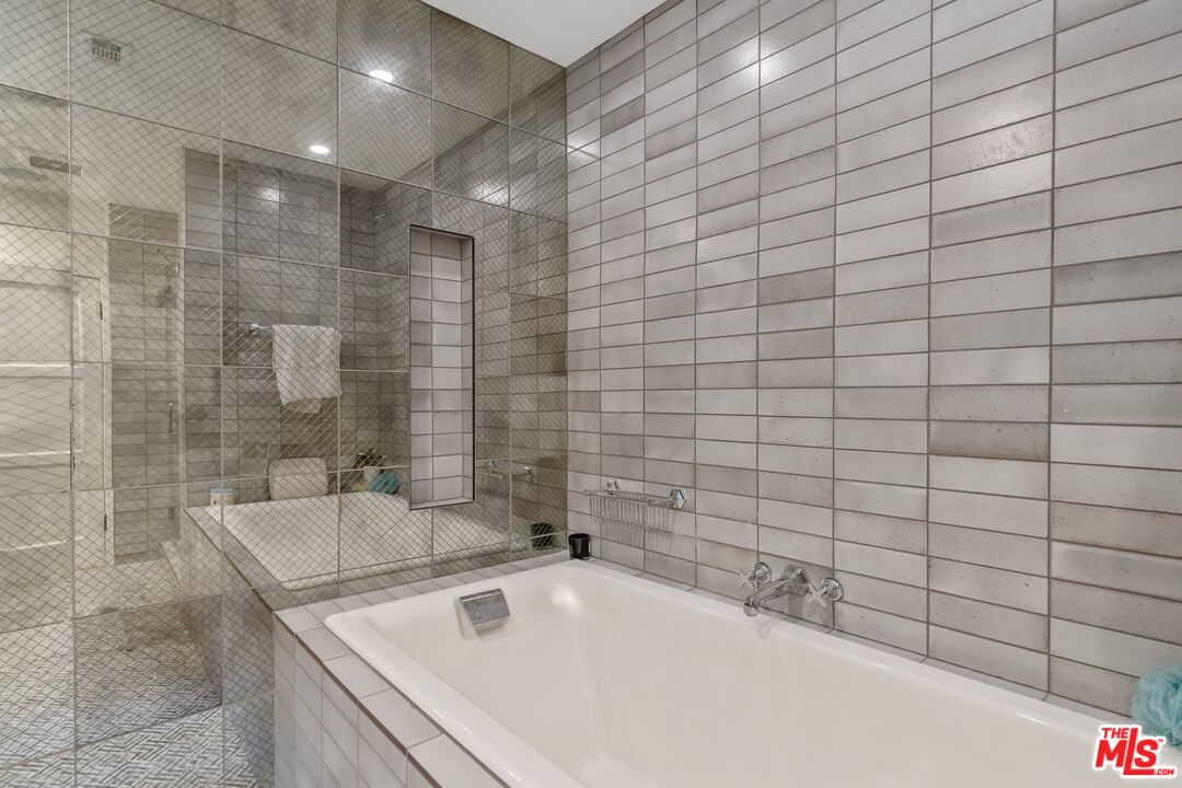 1643 Queens Road Los Angeles, CA 90069 - Photo 28 of 44 a bathroom with a bathtub and shower