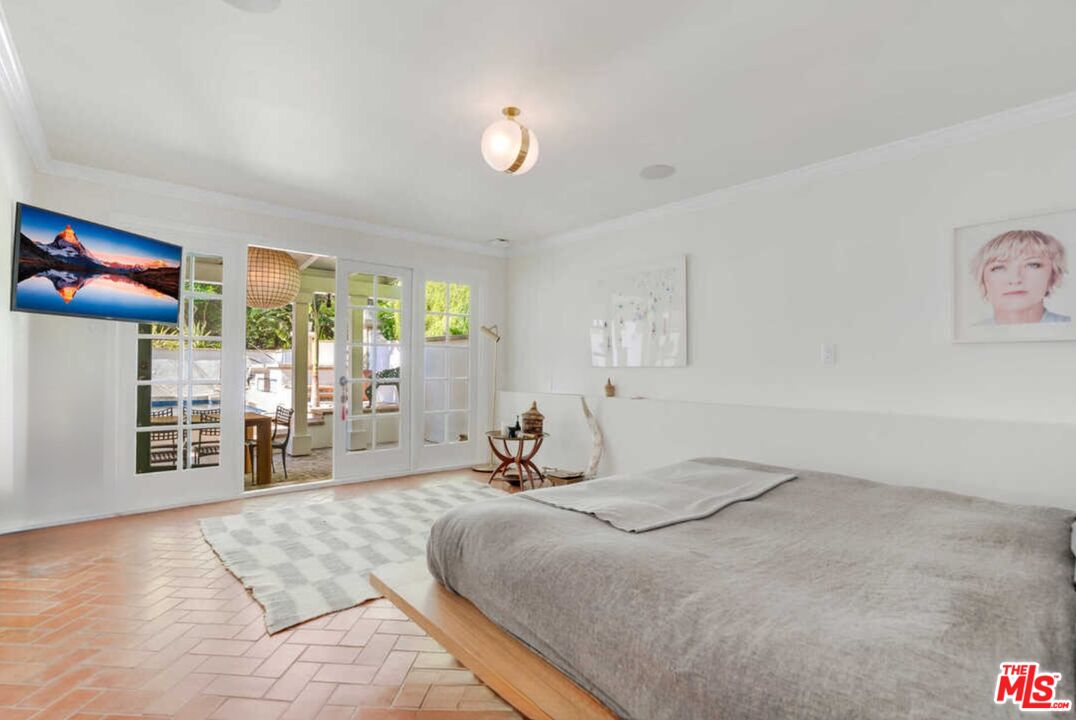 1643 Queens Road Los Angeles, CA 90069 - Photo 34 of 44 a bedroom with a bed and window