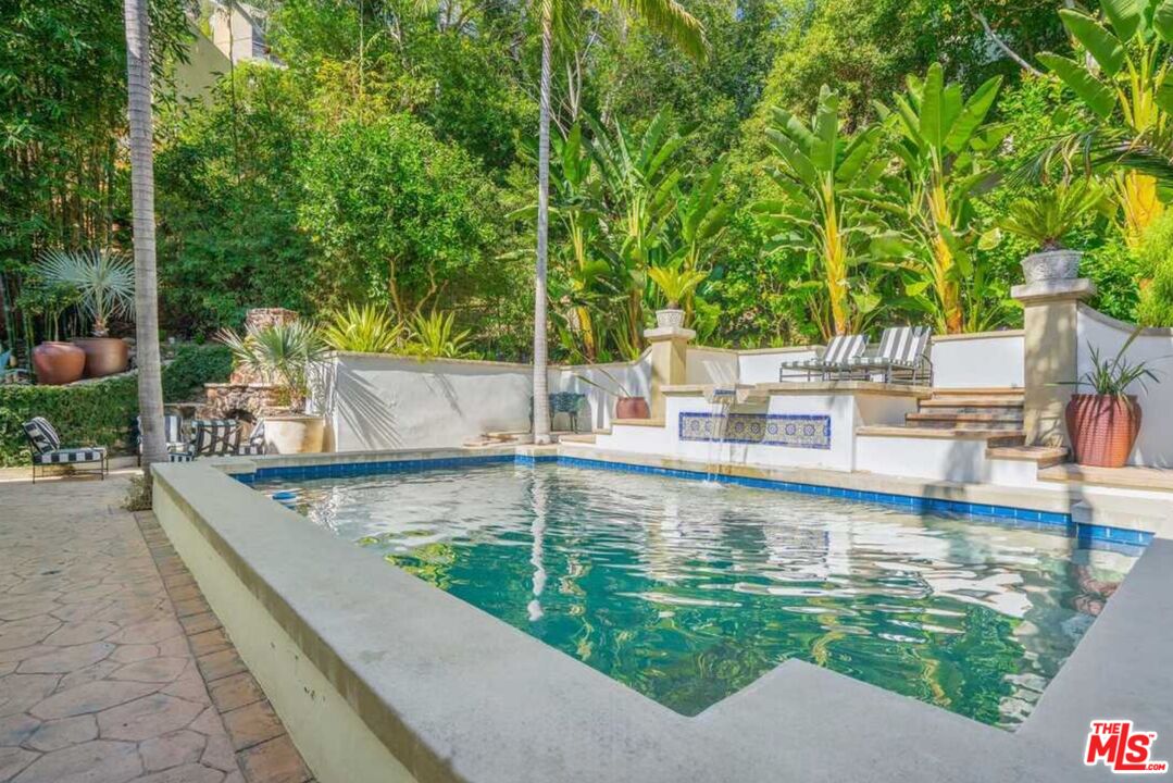1643 Queens Road Los Angeles, CA 90069 - Photo 38 of 44 a view of a swimming pool with chairs