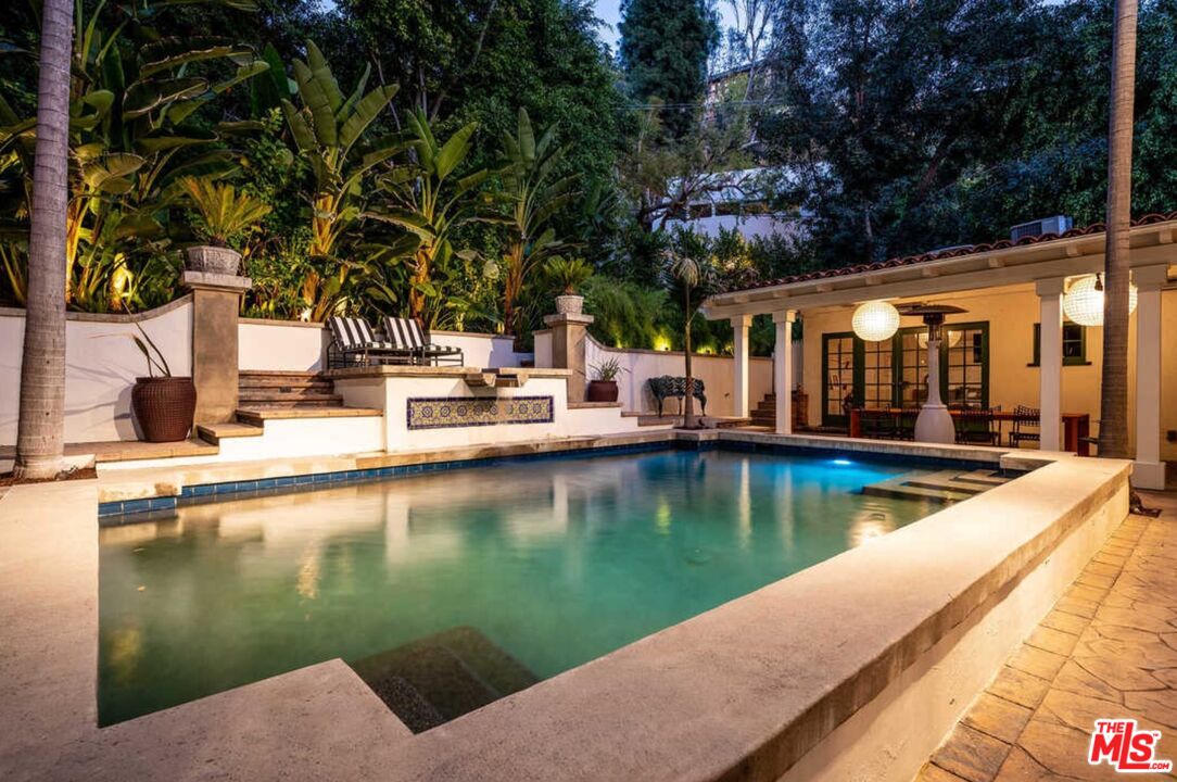 1643 Queens Road Los Angeles, CA 90069 - Photo 40 of 44 a view of a lake with a house and swimming pool