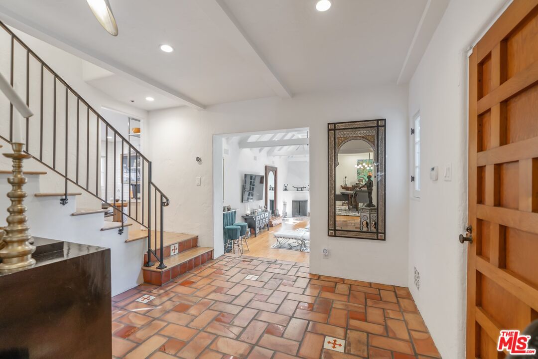 1643 Queens Road Los Angeles, CA 90069 - Photo 5 of 44 a view of a hallway with wooden floor and staircase