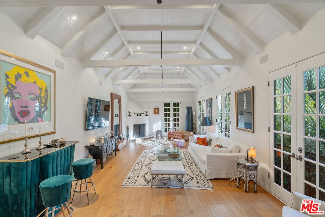 1643 Queens Road Los Angeles, CA 90069 - Photo 7 of 44 a living room with furniture large window and flat screen tv