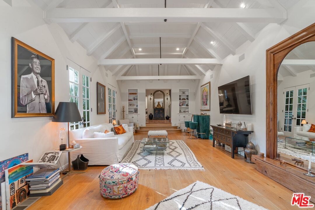 1643 Queens Road Los Angeles, CA 90069 - Photo 9 of 44 a living room with furniture and a flat screen tv