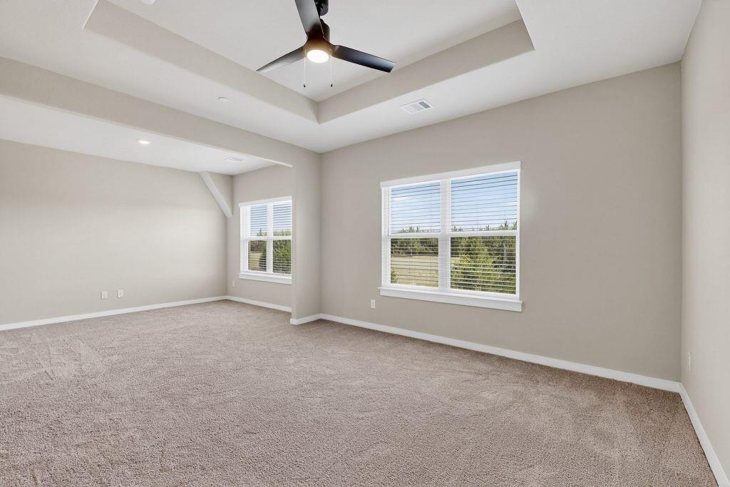 1614 Governors Boulevard Heath, TX 75126 - Photo 15 of 37 an empty room with a window and a ceiling fan