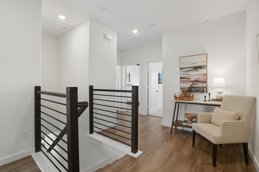 1614 Governors Boulevard Heath, TX 75126 - Photo 16 of 37 a living room with furniture a wooden floor and a window