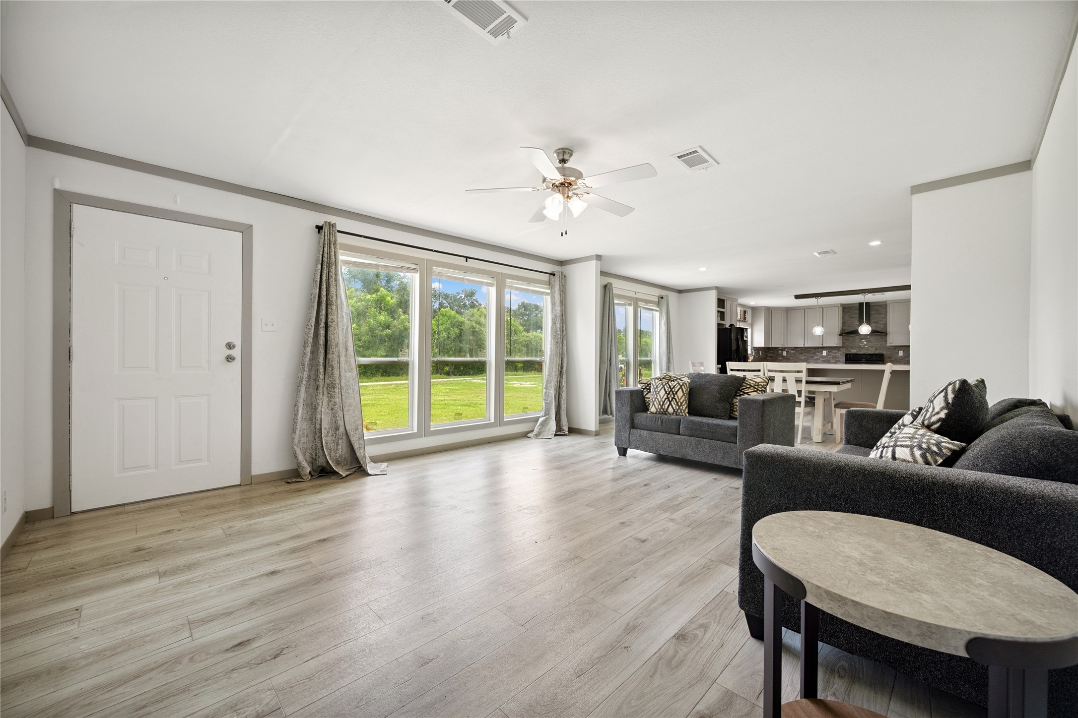 3006 County Road 2068 Hull, TX 77564 - Photo 15 of 27 a living room with furniture and a large window