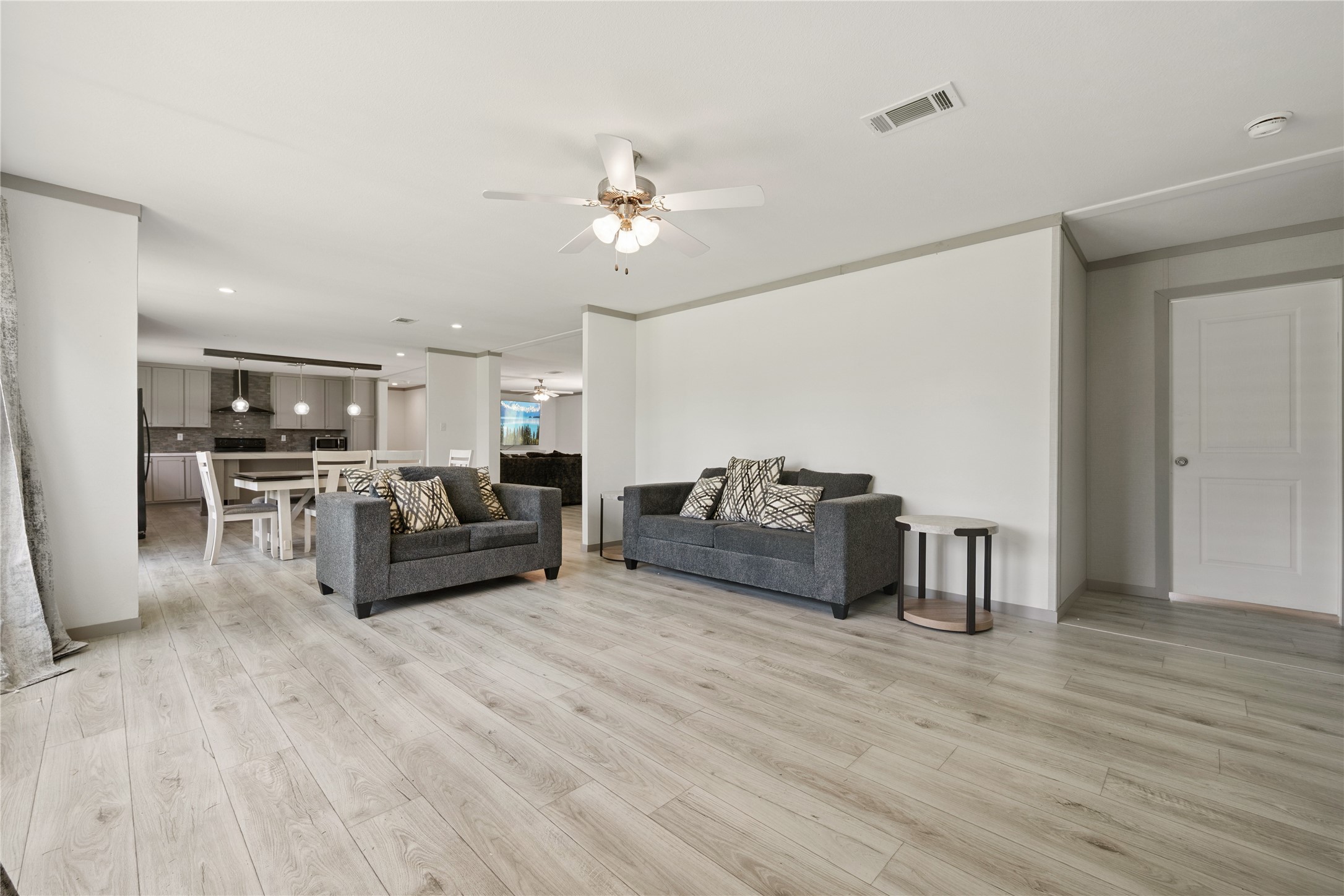 3006 County Road 2068 Hull, TX 77564 - Photo 16 of 27 a living room with furniture and a wooden floor