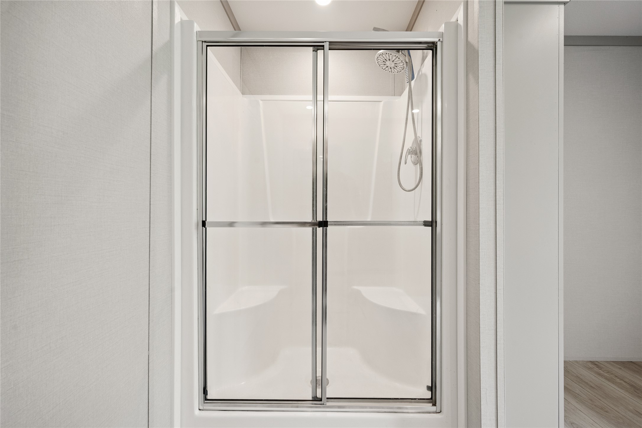 3006 County Road 2068 Hull, TX 77564 - Photo 21 of 27 a bathroom with a glass shower door