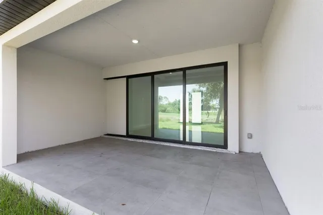 a view of an empty room with a sliding door