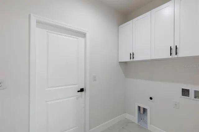 a view of cabinets and wooden floor