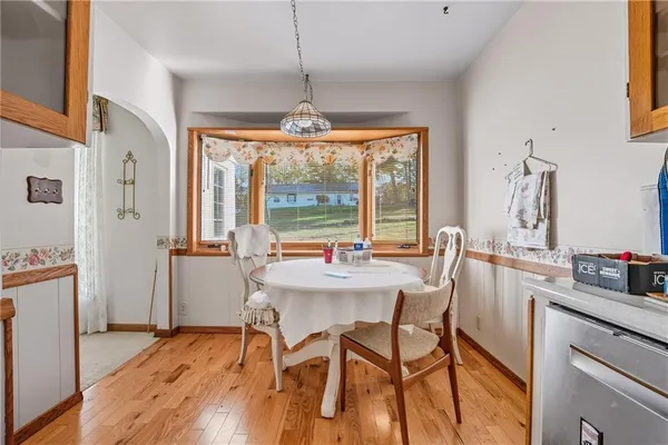 a view of a dining room with furniture window and outside view
