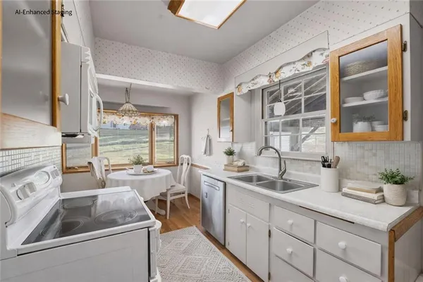a kitchen with sink and cabinets