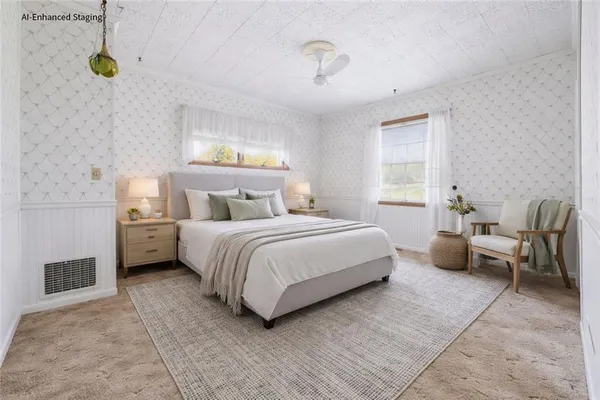 a bedroom with a bed a table and chairs