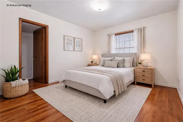 a bedroom with a bed and window