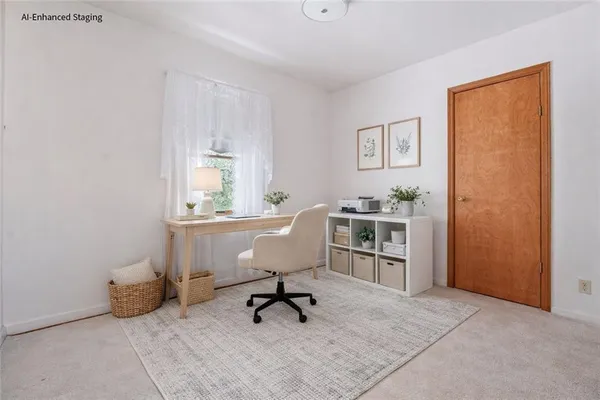 a view of a workspace with furniture