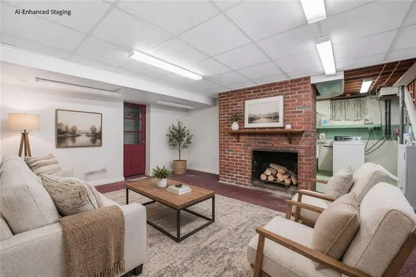 a living room with furniture and a fireplace