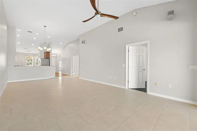 an empty room with a empty space and windows