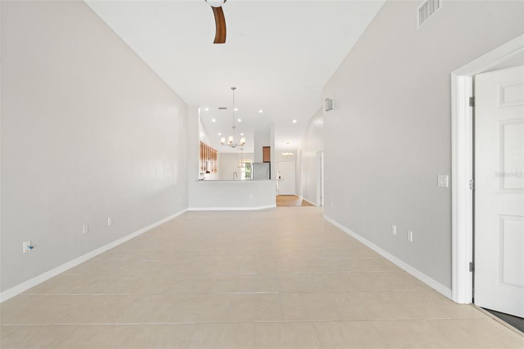 7187 Boca Grove Place, Unit 201 Lakewood Ranch, FL 34202 - Photo 16 of 48 an empty room with a empty space and windows
