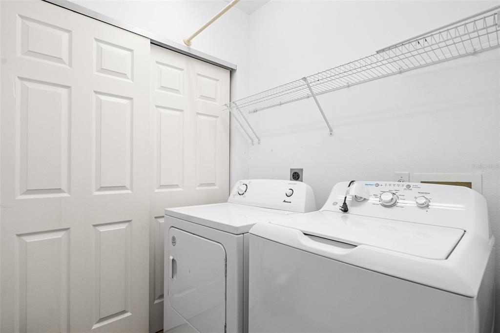 7187 Boca Grove Place, Unit 201 Lakewood Ranch, FL 34202 - Photo 28 of 48 a utility room with dryer and washer