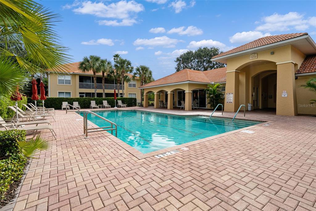 7187 Boca Grove Place, Unit 201 Lakewood Ranch, FL 34202 - Photo 39 of 48 a view of a house with a swimming pool