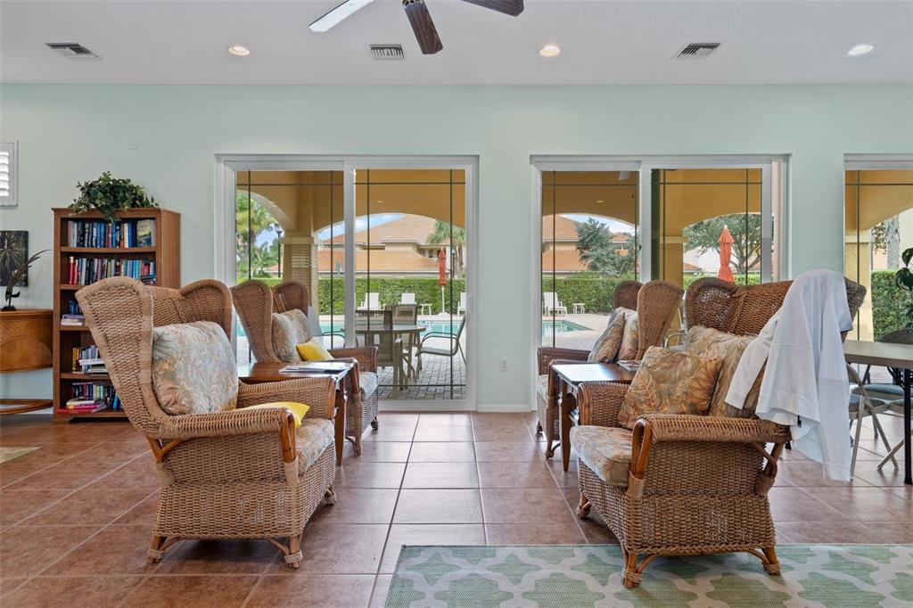 7187 Boca Grove Place, Unit 201 Lakewood Ranch, FL 34202 - Photo 43 of 48 a living room with furniture and a large window