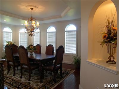 201 Gower Road Nazareth, PA 18064 - Photo 14 of 34 a view of a dining room with furniture and a chandelier