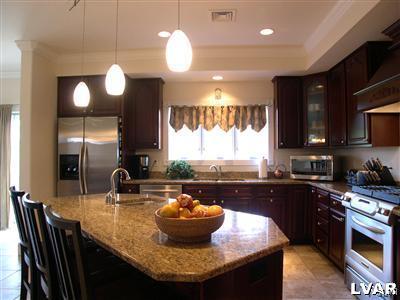 201 Gower Road Nazareth, PA 18064 - Photo 16 of 34 a kitchen with granite countertop a stove a sink and a refrigerator