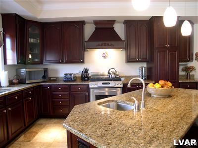 201 Gower Road Nazareth, PA 18064 - Photo 17 of 34 a kitchen with a sink a stove and cabinets