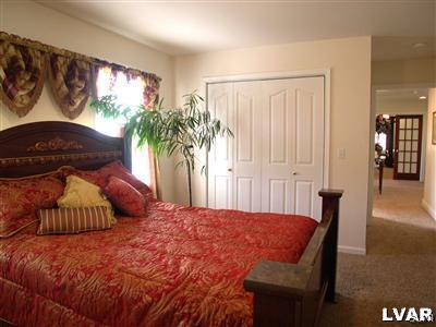 201 Gower Road Nazareth, PA 18064 - Photo 29 of 34 a bedroom with a large bed and a potted plant