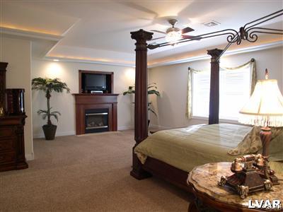 201 Gower Road Nazareth, PA 18064 - Photo 32 of 34 a bed room with a bed and a fireplace