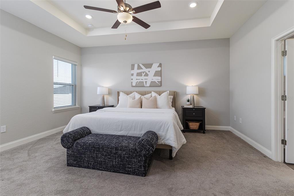 3150 Kendal Way Lakeland, FL 33813 - Photo 18 of 61 a bedroom with a bed and window