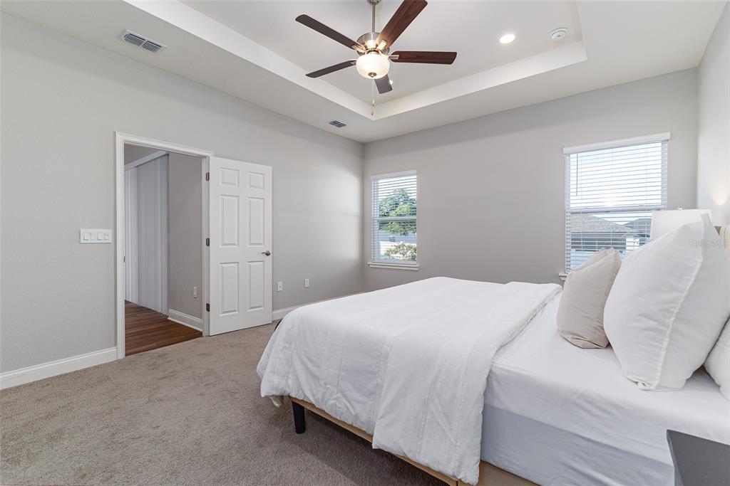 3150 Kendal Way Lakeland, FL 33813 - Photo 20 of 61 a bedroom with a bed and a ceiling fan