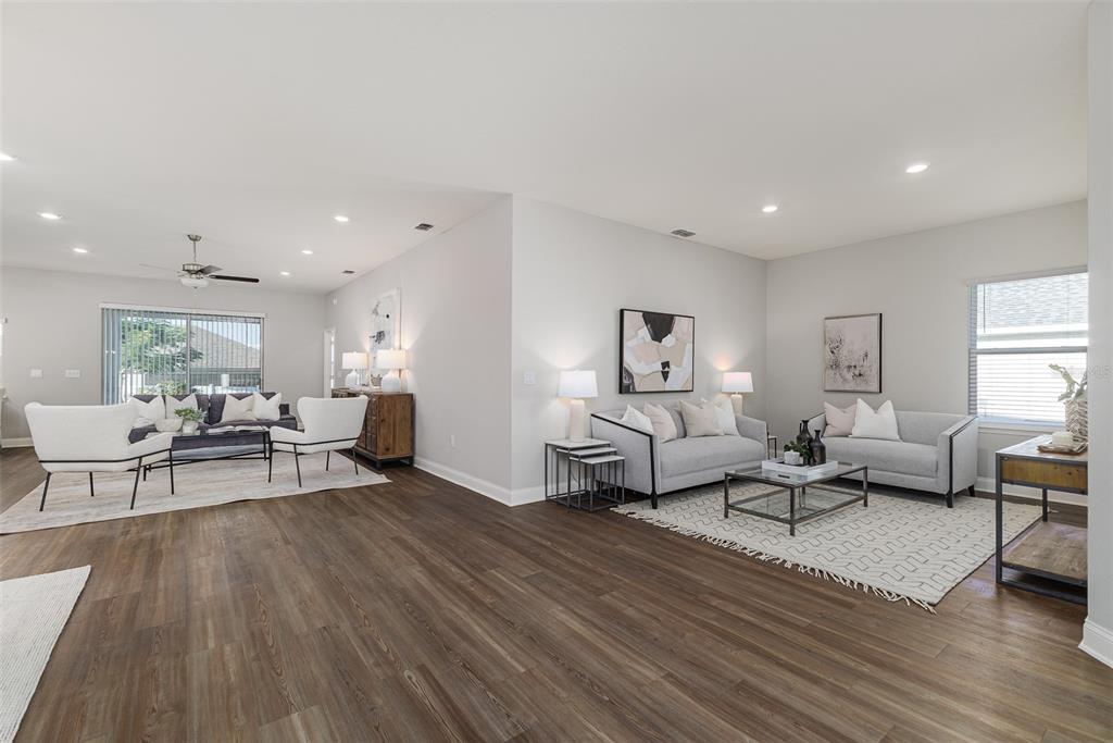 3150 Kendal Way Lakeland, FL 33813 - Photo 3 of 61 a living room with furniture and a wooden floor
