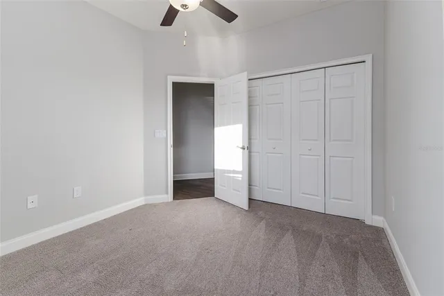 a bedroom with furniture and wooden floor