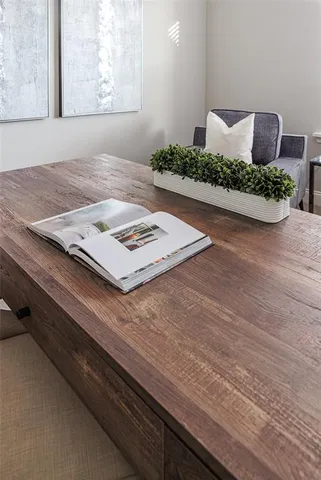 a living room with furniture and next to a window