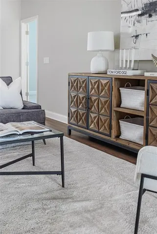 a living room with furniture and a table