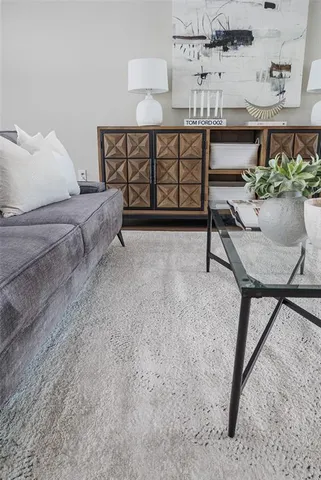 a room with a chair and a lamp with window