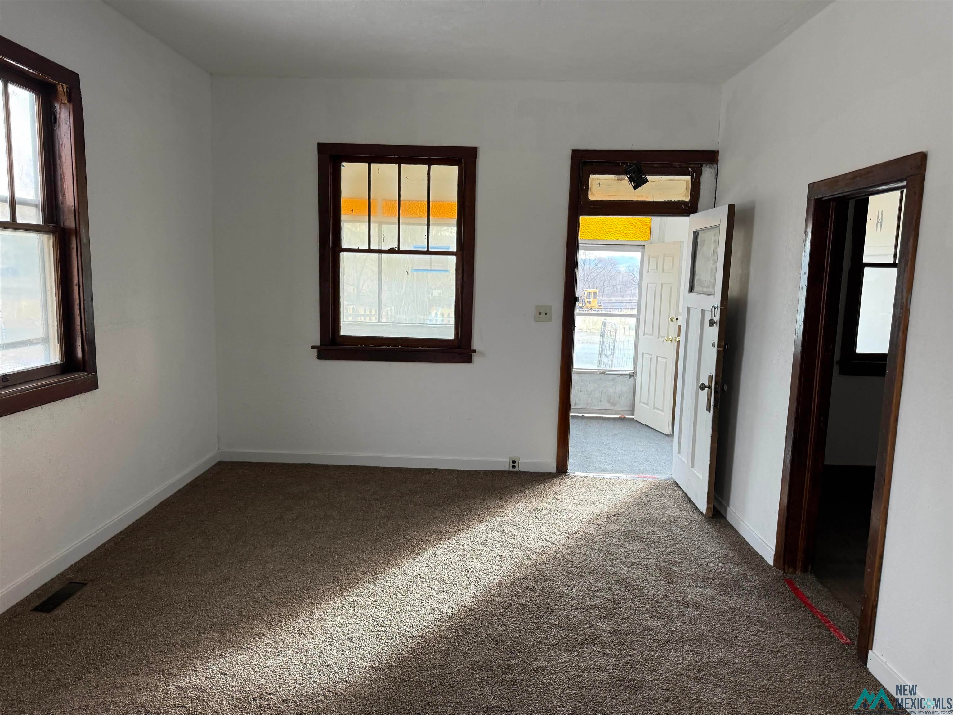 524 South 1st Street Raton, NM 87740 - Photo 2 of 21 Carpeted empty room featuring baseboards