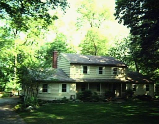 74 Flint Ridge Road Monroe, CT 06468 - Photo 1 of 1 a front view of a house with a garden