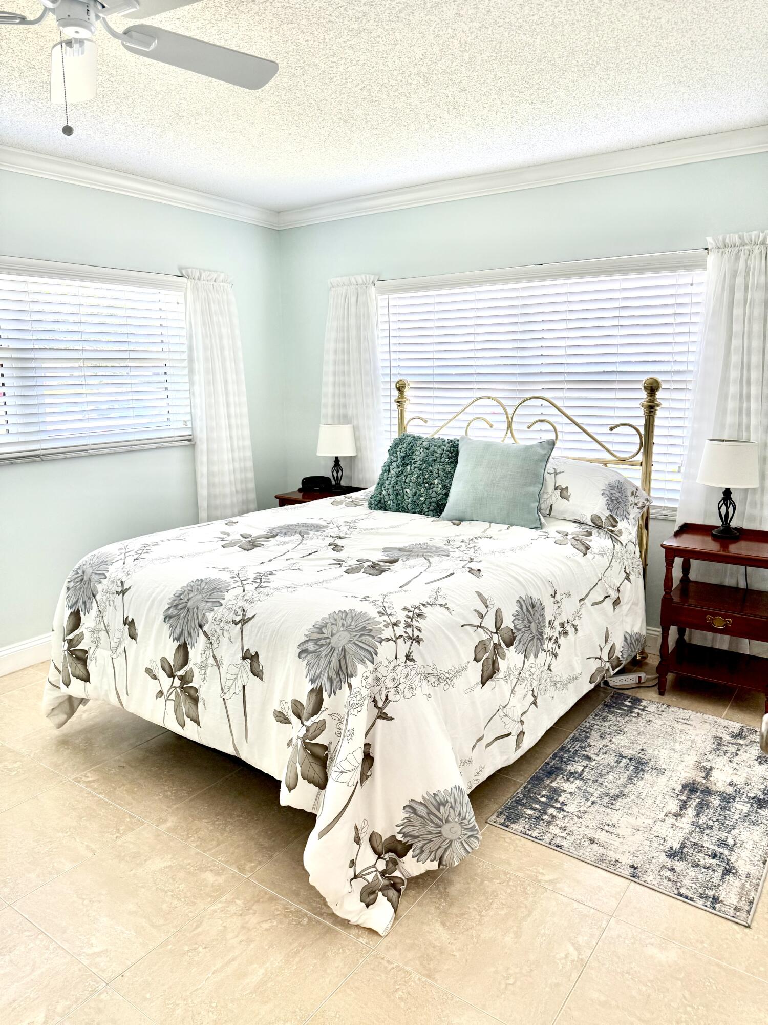 828 Timberview Drive, Unit D Fort Pierce, FL 34982 - Photo 11 of 28 a bedroom with a bed and a window