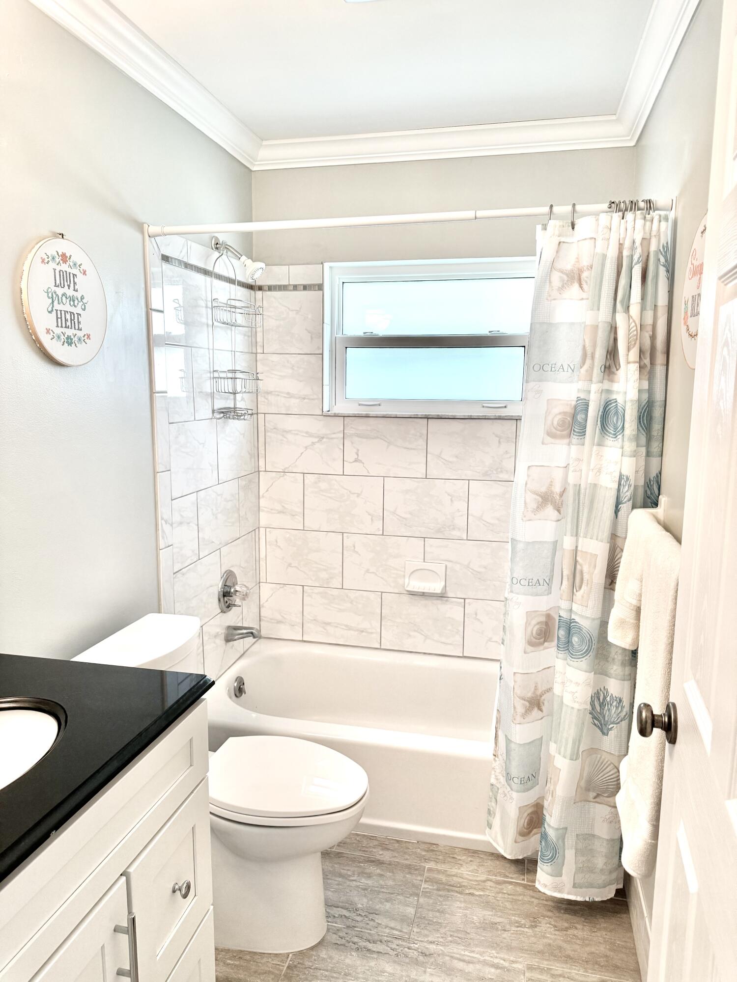 828 Timberview Drive, Unit D Fort Pierce, FL 34982 - Photo 12 of 28 a bathroom with a sink toilet and shower