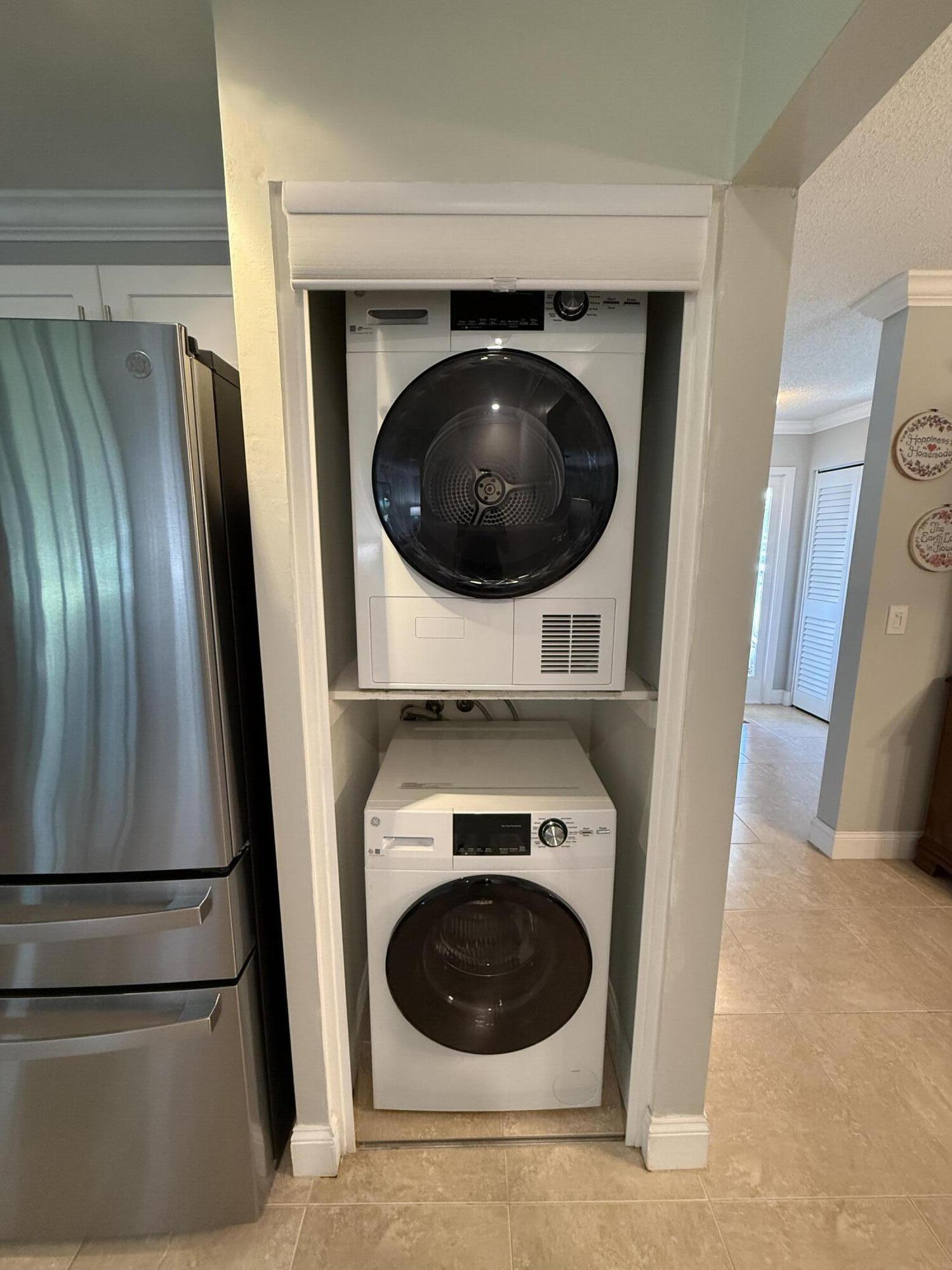 828 Timberview Drive, Unit D Fort Pierce, FL 34982 - Photo 6 of 28 a utility room with dryer and washer